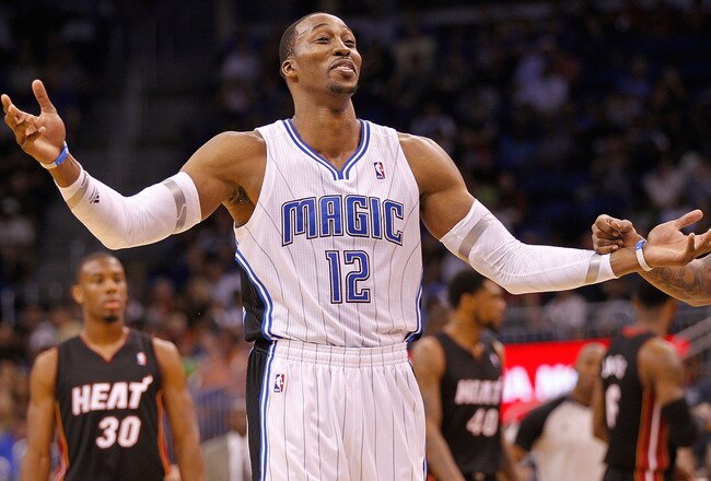 ORLANDO, FL - DECEMBER 21: Dwight Howard #12 of the Orlando Magic argues a call during a preseason game against the Miami Heat at Amway Center on December 21, 2011 in Orlando, Florida. NOTE TO USER: User expressly acknowledges and agrees that, by downloading and/or using this Photograph, User is consenting to the terms and conditions of the Getty Images License Agreement.  (Photo by Mike Ehrmann/Getty Images)
