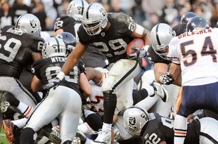 OAKLAND, CA - NOVEMBER 27:  Michael Bush #29 of the Oakland Raiders rushes three yards for a touchdown against the Chicago Bears at O.co Coliseum on November 27, 2011 in Oakland, California.  (Photo by Thearon W. Henderson/Getty Images)