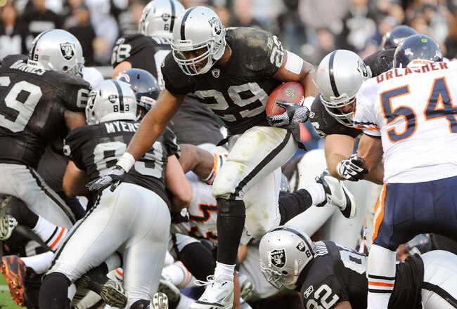 OAKLAND, CA - NOVEMBER 27:  Michael Bush #29 of the Oakland Raiders rushes three yards for a touchdown against the Chicago Bears at O.co Coliseum on November 27, 2011 in Oakland, California.  (Photo by Thearon W. Henderson/Getty Images)