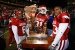 BATON ROUGE, LA - NOVEMBER 23:  Members of the Arkansas Razorbacks celebrate with 'The Boot' trophy after defeating the #1 ranked Louisiana State University Tigers in triple overtime 50-48 at Tiger Stadium November 23, 2007 in Baton Rouge, Louisiana.  (Photo by Chris Graythen/Getty Images)