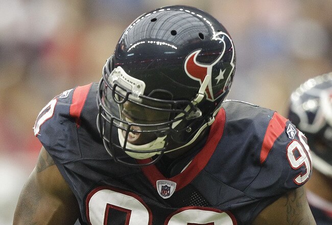 HOUSTON - OCTOBER 09: Outside linebacker Mario Williams #90 of the Houston Texans reacts after a big defensive stop in the first quarter against the Oakland Raiders at Reliant Stadium on October 9, 2011 in Houston, Texas. (Photo by Bob Levey/Getty Images)