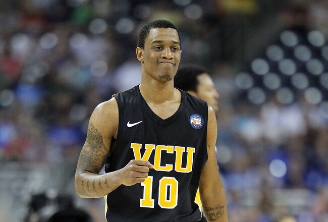 HOUSTON, TX - APRIL 02:  Darius Theus #10 of the Virginia Commonwealth Rams reacts after a play against the Butler Bulldogs during the National Semifinal game of the 2011 NCAA Division I Men's Basketball Championship at Reliant Stadium on April 2, 2011 in Houston, Texas.  (Photo by Andy Lyons/Getty Images)