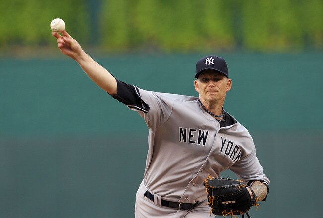 KANSAS CITY, MO - AUGUST 15:  Starting pitcher A.J. Burnett #34 of the New York Yankees warms up just prior to the start of the game against the Kansas City Royals at Kauffman Stadium on August 15, 2011 in Kansas City, Missouri.  (Photo by Jamie Squire/Getty Images)