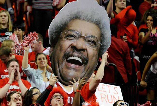 LAS VEGAS, NV - FEBRUARY 11:  UNLV Rebels fans hold up a cutout image of boxing promoter Don King before the team's game against the San Diego State Aztecs at the Thomas & Mack Center February 11, 2012 in Las Vegas, Nevada. UNLV won 65-63.  (Photo by Ethan Miller/Getty Images)
