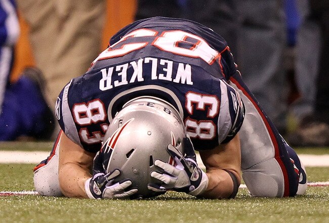 INDIANAPOLIS, IN - FEBRUARY 05:  Wide receiver Wes Welker #83 of the New England Patriots reacts after dropping a pass in the fourth quarter while taking on the New York Giants during Super Bowl XLVI at Lucas Oil Stadium on February 5, 2012 in Indianapolis, Indiana.  (Photo by Ezra Shaw/Getty Images)