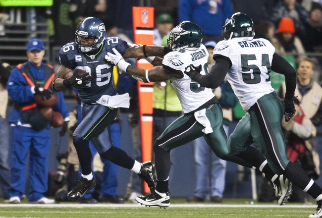 SEATTLE, WA - DECEMBER 1:  Michael Robinson #26 of the Seattle Seahawks runs past Akeem Jordan #56 and Jamar Chaney #51 of the Philadelphia Eagles  at CenturyLink Field December 1, 2011 in Seattle, Washington. Seattle won 31-14. (Photo by Jay Drowns/Getty Images)