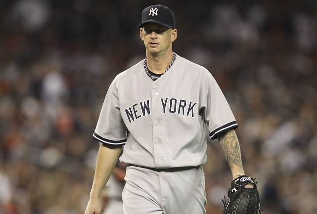 DETROIT, MI - OCTOBER 04:  A J Burnett #34 of the New York Yankees pitches in the sixth inning during Game Four of the American League Divison Series against the Detroit Tigers at Comerica Park on October 4, 2011 in Detroit, Michigan. The Yankees defeated the Tigers 10-1.  (Photo by Leon Halip/Getty Images)