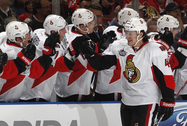 SUNRISE, FL - FEBRUARY 15: Jim O'Brien #42 of the Ottawa Senators is congratulated by teammates after scoring a first-period goal against the Florida Panthers on February 15, 2012 at the BankAtlantic Center in Sunrise, Florida. (Photo by Joel Auerbach/Getty Images)