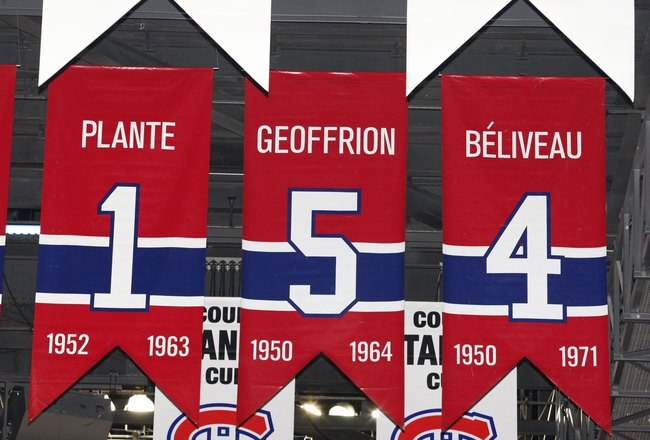 MONTREAL- APRIL 19:  A photo of the banners commemorating the retired jerseys of Jacque Plante, Bernard Geoffrion and Jean Beliveau hanging in the Bell Centre prior to Game Three of the Eastern Conference Quarterfinals between the Washington Capitals and Montreal Canadiens during the 2010 NHL Stanley Cup Playoffs at the Bell Centre on April 19, 2010 in Montreal, Quebec, Canada.  The Capitals defeated the Canadiens 5-1 and now lead the series 2-1.  (Photo by Richard Wolowicz/Getty Images)