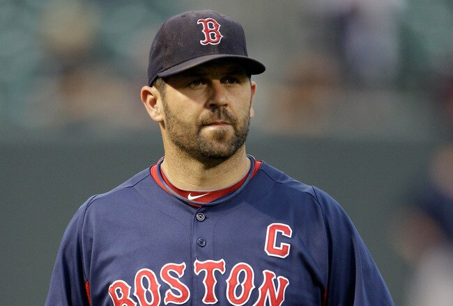 BALTIMORE, MD - SEPTEMBER 27:  Jason Varitek #33 of the Boston Red Sox walks in from the outfield after throwing before the start of the Red Sox game against the Baltimore Orioles at Oriole Park at Camden Yards on September 27, 2011 in Baltimore, Maryland.  (Photo by Rob Carr/Getty Images)