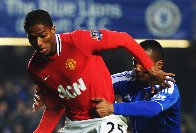 LONDON, ENGLAND - FEBRUARY 05:  Florent Malouda of Chelsea battles with Antonio Valencia of Manchester United during the Barclays Premier League match between Chelsea and Manchester United at Stamford Bridge on February 5, 2012 in London, England.  (Photo by Mike Hewitt/Getty Images)