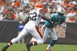 CLEVELAND, OH - SEPTEMBER 25:  Wide receiver Davone Bess #15 of the Miami Dolphins runs by linebacker D'Qwell Jackson #52 of the Cleveland Browns at Cleveland Browns Stadium on September 25, 2011 in Cleveland, Ohio.  (Photo by Matt Sullivan/Getty Images)