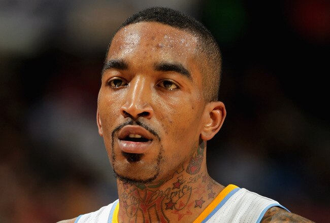 DENVER, CO - MARCH 21:  J.R. Smith #5 of the Denver Nuggets looks on during a break in the action against the Toronto Raptors at the Pepsi Center on March 21, 2011 in Denver, Colorado. The Nuggets defeated the Raptors 123-90. NOTE TO USER: User expressly acknowledges and agrees that, by downloading and or using this photograph, User is consenting to the terms and conditions of the Getty Images License Agreement.  (Photo by Doug Pensinger/Getty Images)