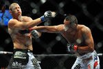 LAS VEGAS - JULY 11:  (R-L) Dan Henderson connects with a right to Mike Bisping during their middleweight bout during UFC 100 on July 11, 2009 in Las Vegas, Nevada.  (Photo by Jon Kopaloff/Getty Images)
