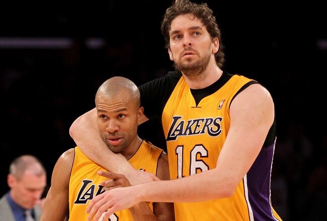 LOS ANGELES, CA - JANUARY 16:  Derek Fisher #2 of the Los Angeles Lakers celebrates with Pau Gasol #16 after Fisher stole the ball and scored a break away basket against the Dallas Mavericks at Staples Center on January 16, 2012 in Los Angeles, California.  The Lakers won 73-70.  NOTE TO USER: User expressly acknowledges and agrees that, by downloading and or using this photograph, User is consenting to the terms and conditions of the Getty Images License Agreement.  (Photo by Stephen Dunn/Getty Images)