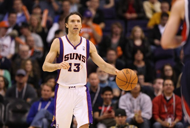 PHOENIX, AZ - FEBRUARY 15:  Steve Nash #13 of the Phoenix Suns handles the ball during the NBA game against the Atlanta Hawks at US Airways Center on February 15, 2012 in Phoenix, Arizona. The Hawks defeated the Suns 101-99. NOTE TO USER: User expressly acknowledges and agrees that, by downloading and or using this photograph, User is consenting to the terms and conditions of the Getty Images License Agreement.  (Photo by Christian Petersen/Getty Images)