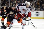 ANAHEIM, CA - FEBRUARY 03:  Rick Nash #61 of the Columbus Blue Jackets fends off Matt Beleskey #39 of the Anaheim Ducks as he carries the puck during the second period at Honda Center on February 3, 2012 in Anaheim, California.  (Photo by Harry How/Getty Images)