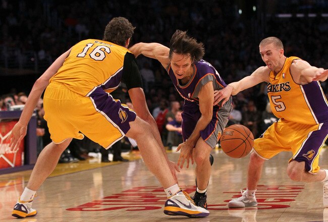 LOS ANGELES, CA - JANUARY 10:  Steve Nash #13 of the Phoenix Suns chases a loose ball against Pau Gasol #16 and Steve Blake #5 of the Los Angeles Lakers at Staples Center on January 10, 2012 in Los Angeles, California.  The Lakers won 99-83. NOTE TO USER: User expressly acknowledges and agrees that, by downloading and or using this photograph, User is consenting to the terms and conditions of the Getty Images License Agreement.  (Photo by Stephen Dunn/Getty Images)