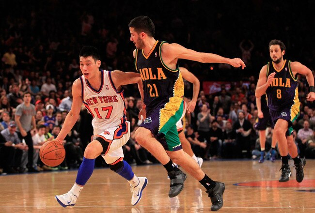 NEW YORK, NY - FEBRUARY 17:  Jeremy Lin #17 of the New York Knicks drives against Greivis Vasquez #21 of the New Orleans Hornets at Madison Square Garden on February 17, 2012 in New York City. NOTE TO USER: User expressly acknowledges and agrees that, by downloading and/or using this Photograph, user is consenting to the terms and conditions of the Getty Images License Agreement.  (Photo by Chris Trotman/Getty Images)