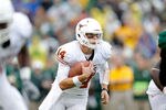 WACO, TX - DECEMBER 03:  David Ash #14 of the Texas Longhorns runs during a game against the Baylor Bears at Floyd Casey Stadium on December 3, 2011 in Waco, Texas.  (Photo by Sarah Glenn/Getty Images)