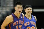 WASHINGTON, DC - FEBRUARY 08: Jeremy Lin #17 of the New York Knicks and Mike Bibby #20 celebrate after Lin scored against the Washington Wizards during the second half at Verizon Center on February 8, 2012 in Washington, DC. NOTE TO USER: User expressly acknowledges and agrees that, by downloading and or using this photograph, User is consenting to the terms and conditions of the Getty Images License Agreement.  (Photo by Rob Carr/Getty Images)