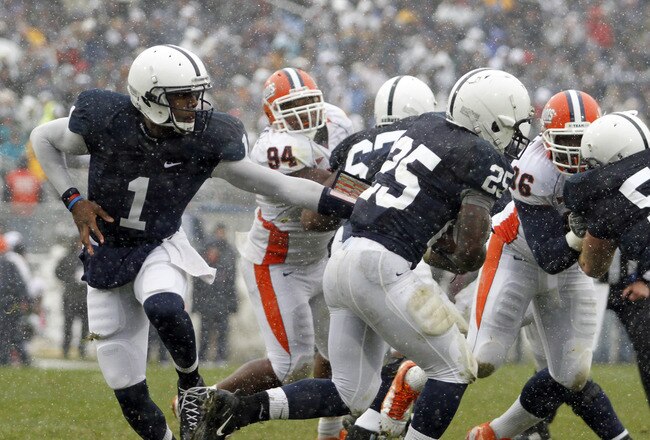 STATE COLLEGE, PA - OCTOBER 29:  Rob Bolden #1 of the Penn State Nittany Lions hands the ball off to Silas Redd #25 against the Illinois Fighting Illini during the game on October 29, 2011 at Beaver Stadium in State College, Pennsylvania.  (Photo by Justin K. Aller/Getty Images)