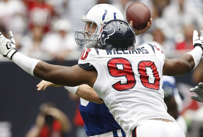 HOUSTON - SEPTEMBER 12:  Defensive end Mario Williams #90 of the Houston Texans applies pressure to quarterback Peyton Manning #18 of the Indianapolis Colts  during the NFL season opener at Reliant Stadium on September 12, 2010 in Houston, Texas.  (Photo by Bob Levey/Getty Images)