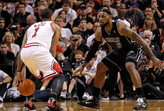 MIAMI, FL - JANUARY 29:  Derrick Rose #1 of the Chicago Bulls is guarded by LeBron James #6 of the Miami Heat during a game at American Airlines Arena on January 29, 2012 in Miami, Florida. NOTE TO USER: User expressly acknowledges and agrees that, by downloading and/or using this Photograph, User is consenting to the terms and conditions of the Getty Images License Agreement.  (Photo by Mike Ehrmann/Getty Images)