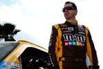 DAYTONA BEACH, FL - FEBRUARY 19:  Kyle Busch, driver of the #18 M&M's Brown Toyota, gets out of his car during qualifying for the NASCAR Sprint Cup Series Daytona 500 at Daytona International Speedway on February 19, 2012 in Daytona Beach, Florida.  (Photo by Jared C. Tilton/Getty Images for NASCAR)