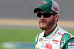 DAYTONA BEACH, FL - FEBRUARY 19:  Dale Earnhardt Jr., driver of the #88 Diet Mountain Dew/National Guard Chevrolet, stands on the grid during qualifying for the NASCAR Sprint Cup Series Daytona 500 at Daytona International Speedway on February 19, 2012 in Daytona Beach, Florida.  (Photo by Jerry Markland/Getty Images for NASCAR)