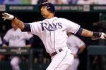 ST PETERSBURG, FL - OCTOBER 03:  Desmond Jennings #8 of the Tampa Bay Rays hits a solo home run in the eighth inning against Mike Adams #37 of the Texas Rangers in Game Three of the American League Division Series at Tropicana Field on October 3, 2011 in St Petersburg, Florida.  (Photo by Mike Ehrmann/Getty Images)