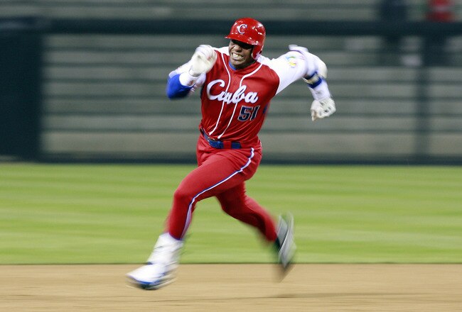 SAN DIEGO - MARCH 18: Yoennis Cespedes #51 of Cuba runs to third base after hitting into the corner of the outfield againts Japan during the 2009 World Baseball Classic Round 2 Pool 1 Game 5 on March 18, 2009 at Petco Park in San Diego, California.  (Photo by Jeff Bottari/Getty Images)