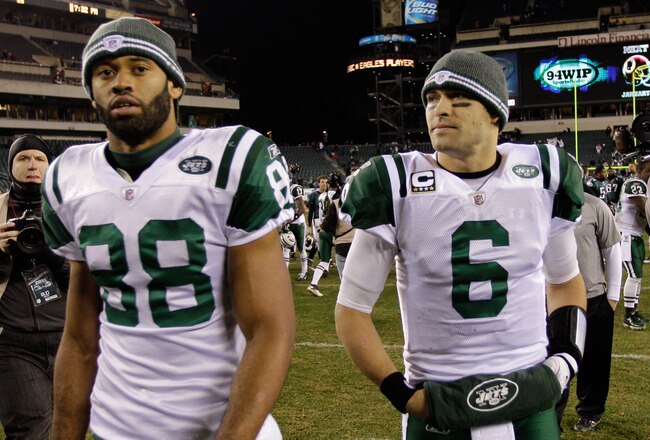 PHILADELPHIA, PA - DECEMBER 18:  Patrick Turner #88 and  Mark Sanchez #6 of the New York Jets walk off the field following the Jets 45-19 loss to the Philadelphia Eagles at Lincoln Financial Field on December 18, 2011 in Philadelphia, Pennsylvania.  (Photo by Rob Carr/Getty Images)
