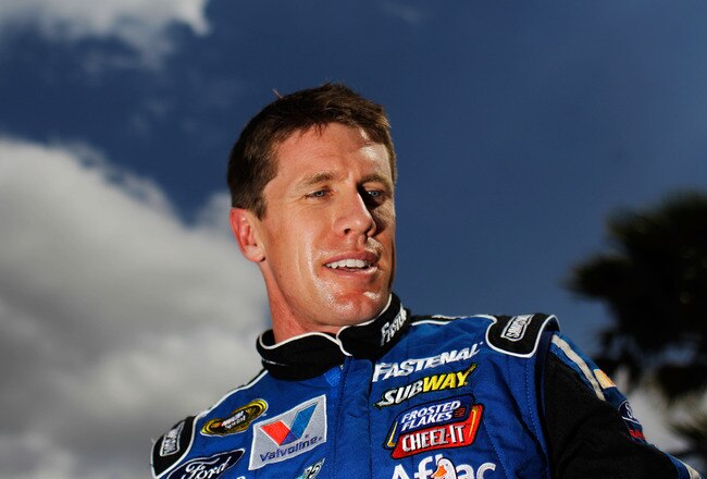 DAYTONA BEACH, FL - FEBRUARY 19:  Carl Edwards, driver of the #99 Fastenal Ford, looks on after qualifying for the NASCAR Sprint Cup Series Daytona 500 at Daytona International Speedway on February 19, 2012 in Daytona Beach, Florida.  (Photo by Tom Pennington/Getty Images for NASCAR)