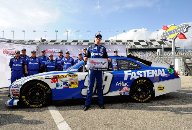 DAYTONA BEACH, FL - FEBRUARY 19: Carl Edwards, driver of the #99 Fastenal Ford, poses with his team  after qualifying for the pole position in the NASCAR Sprint Cup Series Daytona 500 at Daytona International Speedway on February 19, 2012 in Daytona Beach, Florida.  (Photo by John Harrelson/Getty Images for NASCAR)