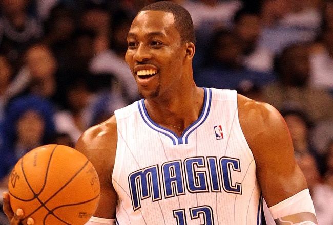 ORLANDO, FL - FEBRUARY 06:  Dwight Howard #12 of the Orlando Magic smiles during the game against the Los Angeles Clippers at Amway Center on February 6, 2012 in Orlando, Florida.   NOTE TO USER: User expressly acknowledges and agrees that, by downloading and or using this Photograph, user is consenting to the terms and conditions of the Getty Images License Agreement.  (Photo by Sam Greenwood/Getty Images)