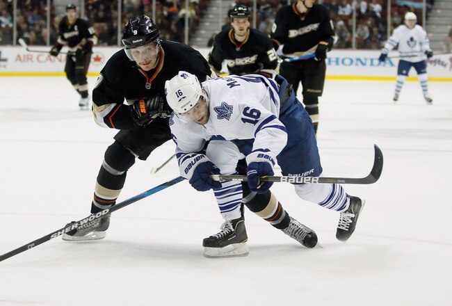 ANAHEIM, CA - NOVEMBER 27:  Clarke MacArthur #16 of the Toronto Maple Leafs and Bobby Ryan #9 of the Anaheim Ducks fight for the puck in the second period at Honda Center on November 27, 2011 in Anaheim, California. The Leafs defeated the Ducks 5-2.  (Photo by Jeff Gross/Getty Images)