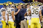 NEW ORLEANS, LA - JANUARY 03:  Head coach Brady Hoke of the Michigan Wolverines talks with his players against the Virginia Tech Hokies during the Allstate Sugar Bowl at Mercedes-Benz Superdome on January 3, 2012 in New Orleans, Louisiana.  (Photo by Kevin C. Cox/Getty Images)