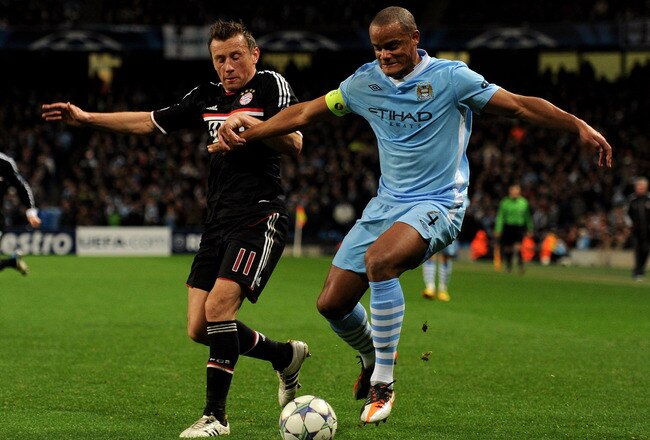 MANCHESTER, ENGLAND - DECEMBER 07:  Ivica Olic of FC Bayern Muenchen competes with Vincent Kompany of Manchester City during the UEFA Champions League Group A match between Manchester City and FC Bayern Muenchen at the Etihad Stadium on December 7, 2011 in Manchester, England.  (Photo by Michael Regan/Getty Images)