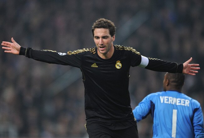 AMSTERDAM, NETHERLANDS - DECEMBER 07:  Gonzalo Higuain of Real Madrid celebrates scoring his sides second goal during the UEFA Champions League group D match between AFC Ajax and Real Madrid at the Amsterdam Arena on December 7, 2011 in Amsterdam, Netherlands.  (Photo by Jasper Juinen/Getty Images)