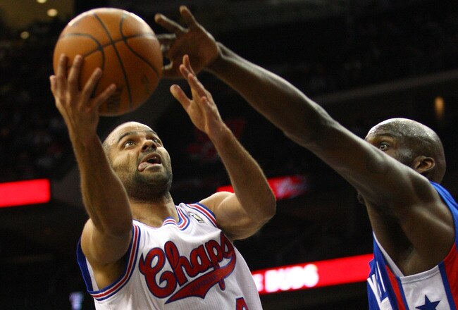 NEWARK, NJ - FEBRUARY 11:  Tony Parker #9 of the San Antonio Spurs drives for a shot attempt against the New Jersey Nets at Prudential Center on February 11, 2012 in Newark, New Jersey.  NOTE TO USER: User expressly acknowledges and agrees that, by downloading and or using this photograph, User is consenting to the terms and conditions of the Getty Images License Agreement.  (Photo by Chris Chambers/Getty Images)