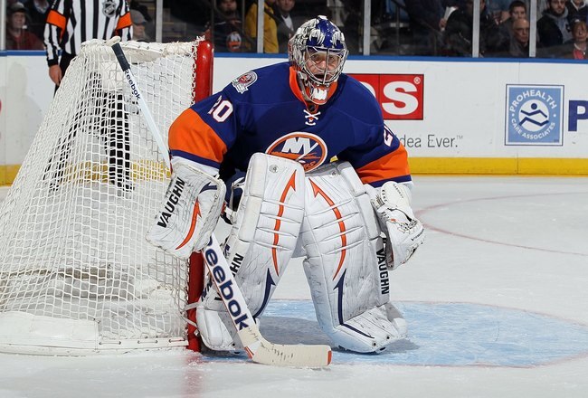 UNIONDALE, NY - FEBRUARY 11:  Evgeni Nabokov #20 of the New York Islanders in action against the Los Angeles Kings  on February 11, 2012 at Nassau Coliseum in Uniondale, New York. The Islanders defeated the Kings 2-1 in overtime.  (Photo by Jim McIsaac/Getty Images)