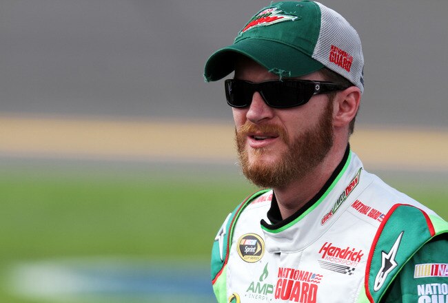 DAYTONA BEACH, FL - FEBRUARY 19:  Dale Earnhardt Jr., driver of the #88 Diet Mountain Dew/National Guard Chevrolet, stands on the grid during qualifying for the NASCAR Sprint Cup Series Daytona 500 at Daytona International Speedway on February 19, 2012 in Daytona Beach, Florida.  (Photo by Jerry Markland/Getty Images for NASCAR)
