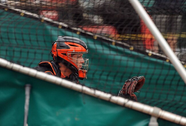 SCOTTSDALE, AZ - FEBRUARY 19:  Buster Posey #28 of the San Francisco Giants catches live batting practice during spring work outs at Scottsdale Stadium on February 19, 2011 in Scottsdale, Arizona.  (Photo by Norm Hall/Getty Images)