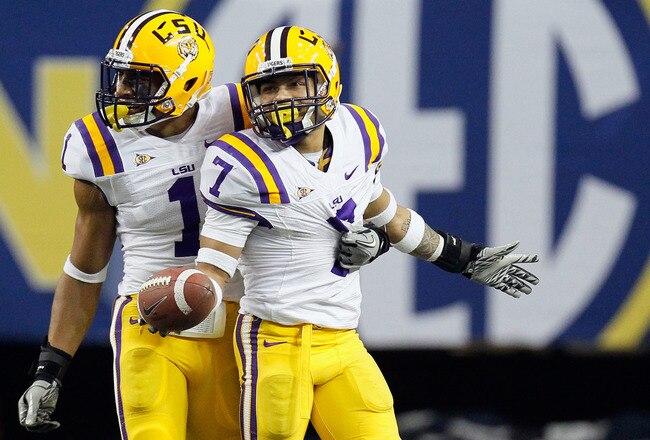 ATLANTA, GA - DECEMBER 03:  (L-R) Eric Reid #1 and Tyrann Mathieu #7 of the LSU Tigers react after Mathieu recovered a fumble by Aaron Murray #11 of the Georgia Bulldogs during the 2011 SEC Conference Championship at  Georgia Dome on December 3, 2011 in Atlanta, Georgia.  (Photo by Kevin C. Cox/Getty Images)