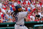 ST. LOUIS - JULY 15:  Manny Ramierez #99 of the Los Angeles Dodgers bats against the St. Louis Cardinals at Busch Stadium on July 15, 2010 in St. Louis, Missouri.  (Photo by Dilip Vishwanat/Getty Images)