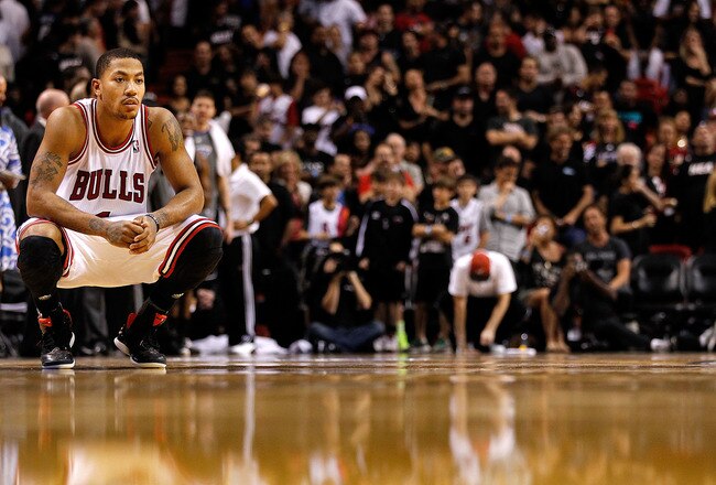 MIAMI, FL - JANUARY 29:  Derrick Rose #1 of the Chicago Bulls looks on during a game against the Miami Heat at American Airlines Arena on January 29, 2012 in Miami, Florida. NOTE TO USER: User expressly acknowledges and agrees that, by downloading and/or using this Photograph, User is consenting to the terms and conditions of the Getty Images License Agreement.  (Photo by Mike Ehrmann/Getty Images)