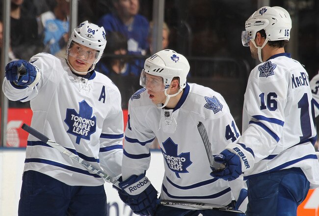 TORONTO, CANADA - FEBRUARY 1:  Mikhail Grabovski #84 of the Toronto Maple Leafs explains a play to linemates Clarke MacArthur #16 and Nikolai Kulemin #41 during a play stoppage in a game against the Pittsburgh Penguins on February 1, 2012 at the Air Canada Centre in Toronto, Canada. The Leafs defeated the Penguins 1-0. (Photo by Claus Andersen/Getty Images)