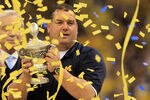 NEW ORLEANS, LA - JANUARY 03:  Head coach Brady Hoke of the Michigan Wolverines celebrates with the trophy after Michigan won 23-20 in overtime against the Virginia Tech Hokies during the Allstate Sugar Bowl at Mercedes-Benz Superdome on January 3, 2012 in New Orleans, Louisiana.  (Photo by Matthew Stockman/Getty Images)