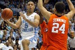 CHAPEL HILL, NC - FEBRUARY 18:  Kendall Marshall #5 of the North Carolina Tar Heels passes the ball around Milton Jennings #24 of the Clemson Tigers during their game at Dean Smith Center on February 18, 2012 in Chapel Hill, North Carolina.  (Photo by Streeter Lecka/Getty Images)